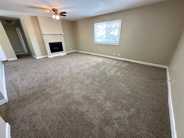 209 Andover Court Bolingbrook, IL 60440 - Photo 2 of 14 an empty room with windows fireplace and fans