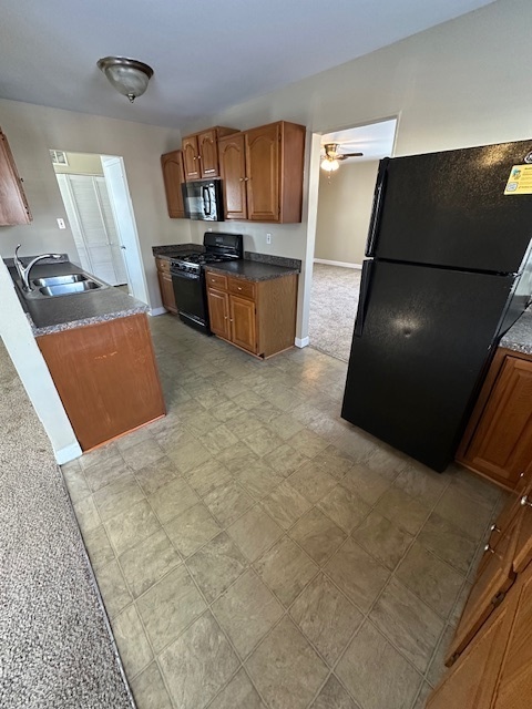 209 Andover Court Bolingbrook, IL 60440 - Photo 4 of 14 a kitchen with granite countertop a refrigerator and a stove top oven