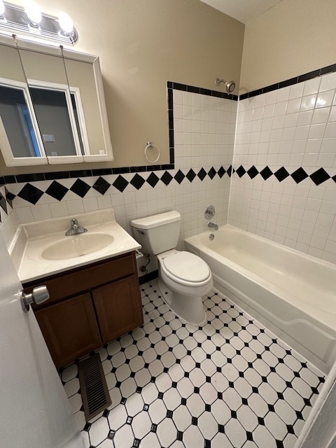 209 Andover Court Bolingbrook, IL 60440 - Photo 8 of 14 a bathroom with a sink a toilet and shower