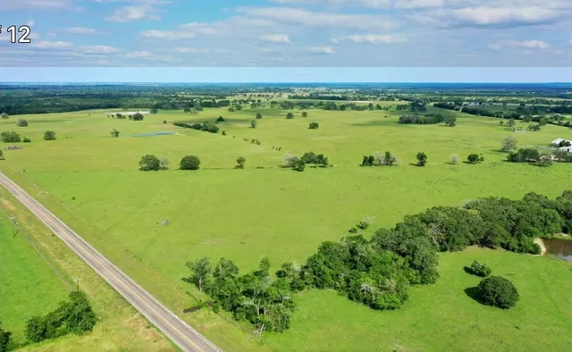 a view of a large body of water with a building in the background