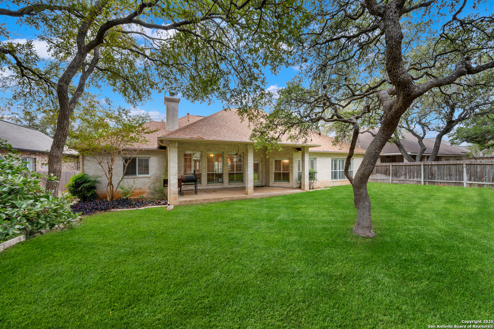 3911 Heights Way San Antonio, TX 78230 - Photo 18 of 22 a view of a house with a backyard