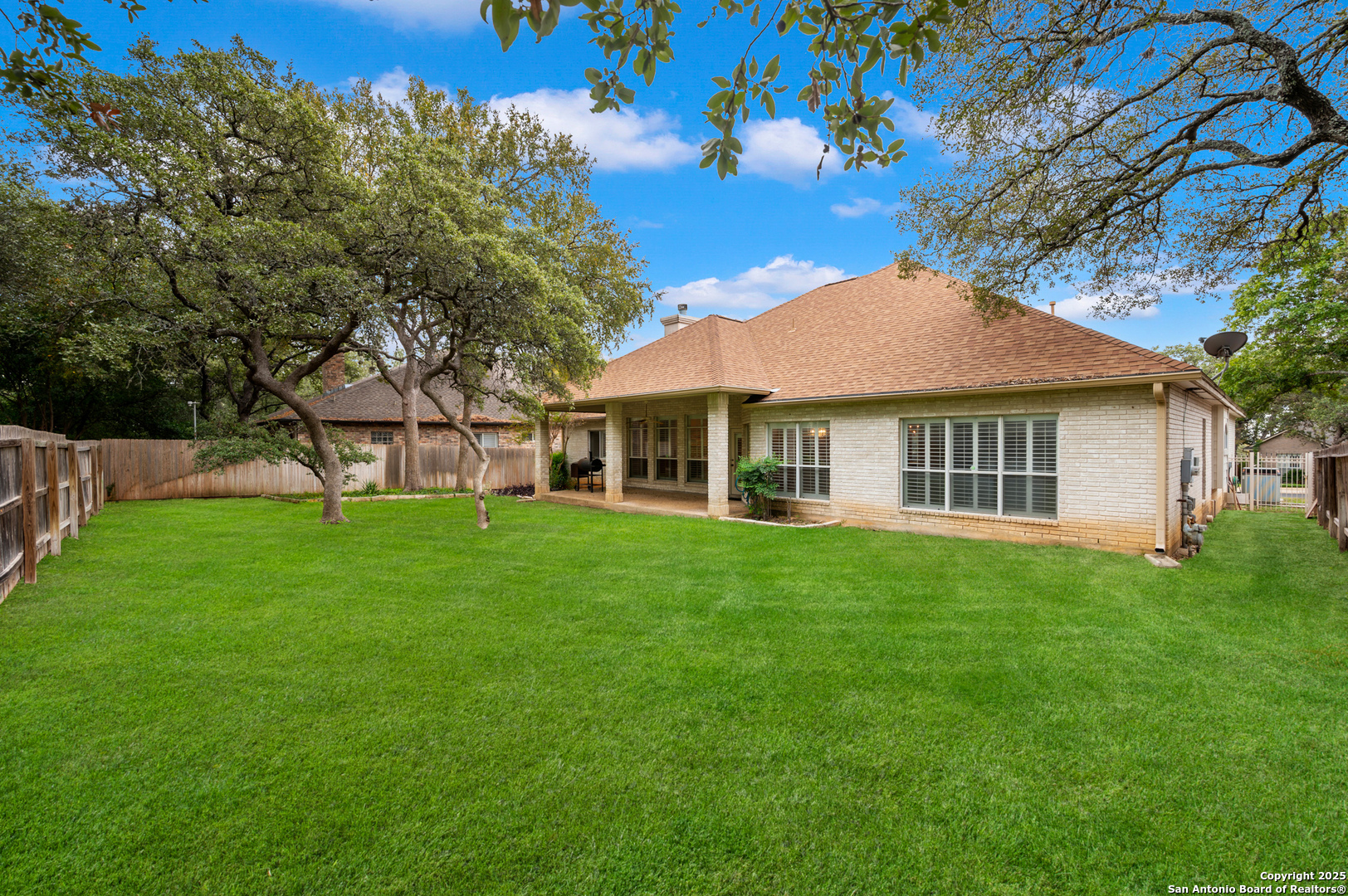 3911 Heights Way San Antonio, TX 78230 - Photo 19 of 22 a view of a house with a yard