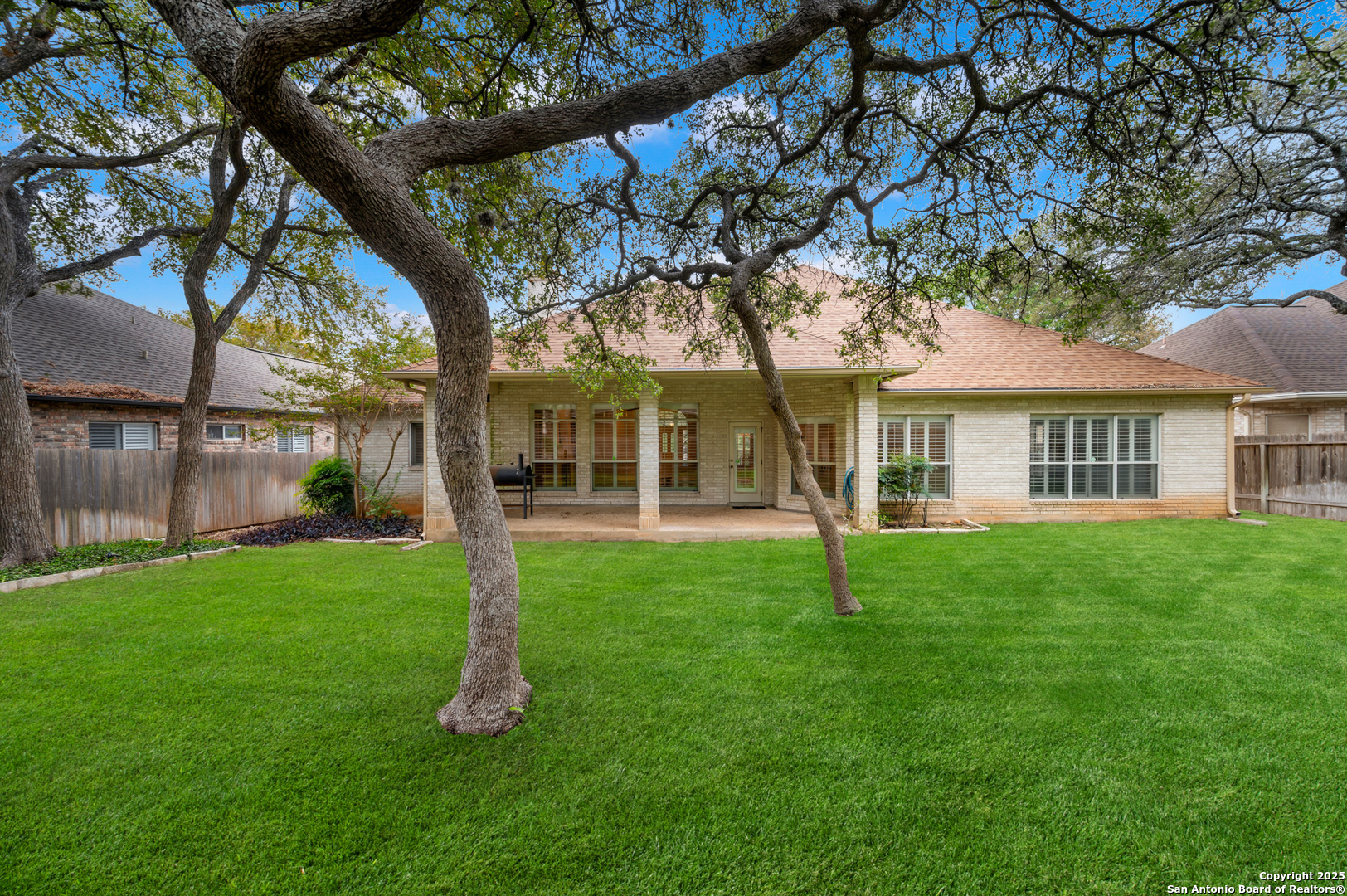 3911 Heights Way San Antonio, TX 78230 - Photo 20 of 22 a house with green field in front of it