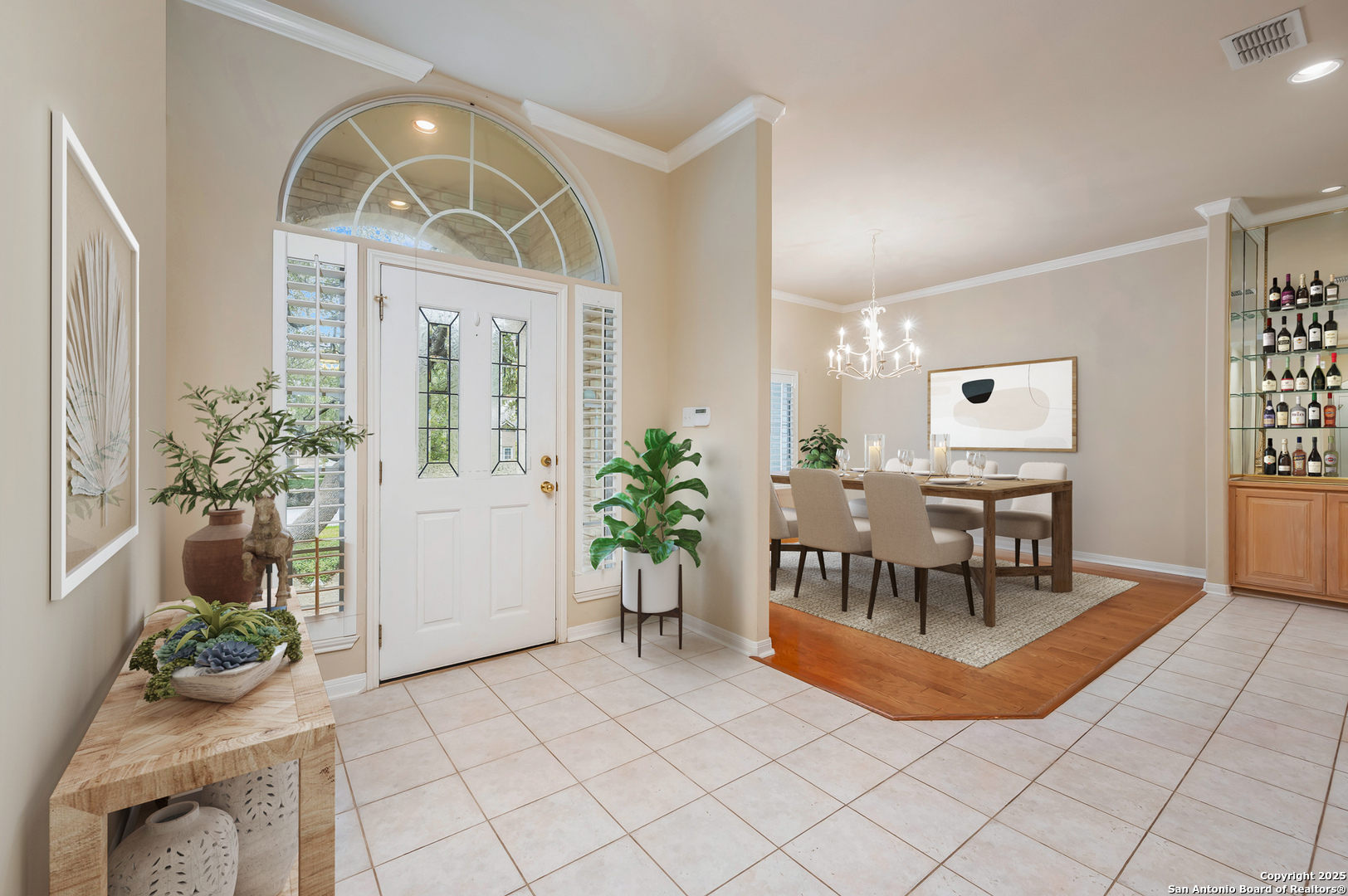 3911 Heights Way San Antonio, TX 78230 - Photo 3 of 22 an entryway with a flower pot and a dining table