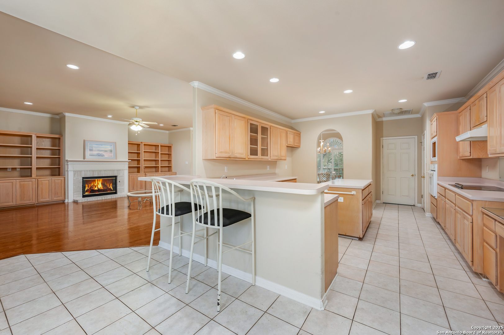 3911 Heights Way San Antonio, TX 78230 - Photo 8 of 22 a kitchen with stainless steel appliances kitchen island granite countertop a stove a sink a dining table and chairs