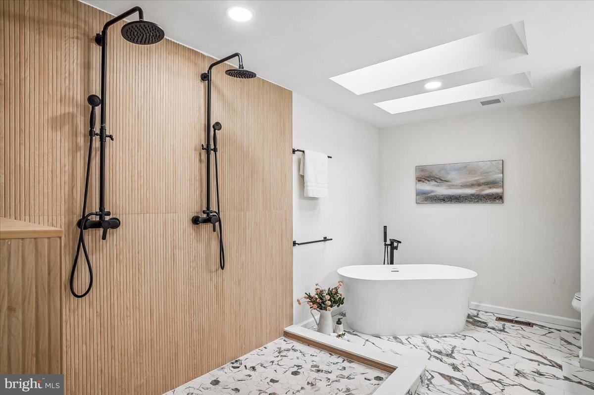 6300 Hickory Bend Road Brandywine, MD 20613 - Photo 16 of 33 Sleek spa-inspired bathroom retreat.