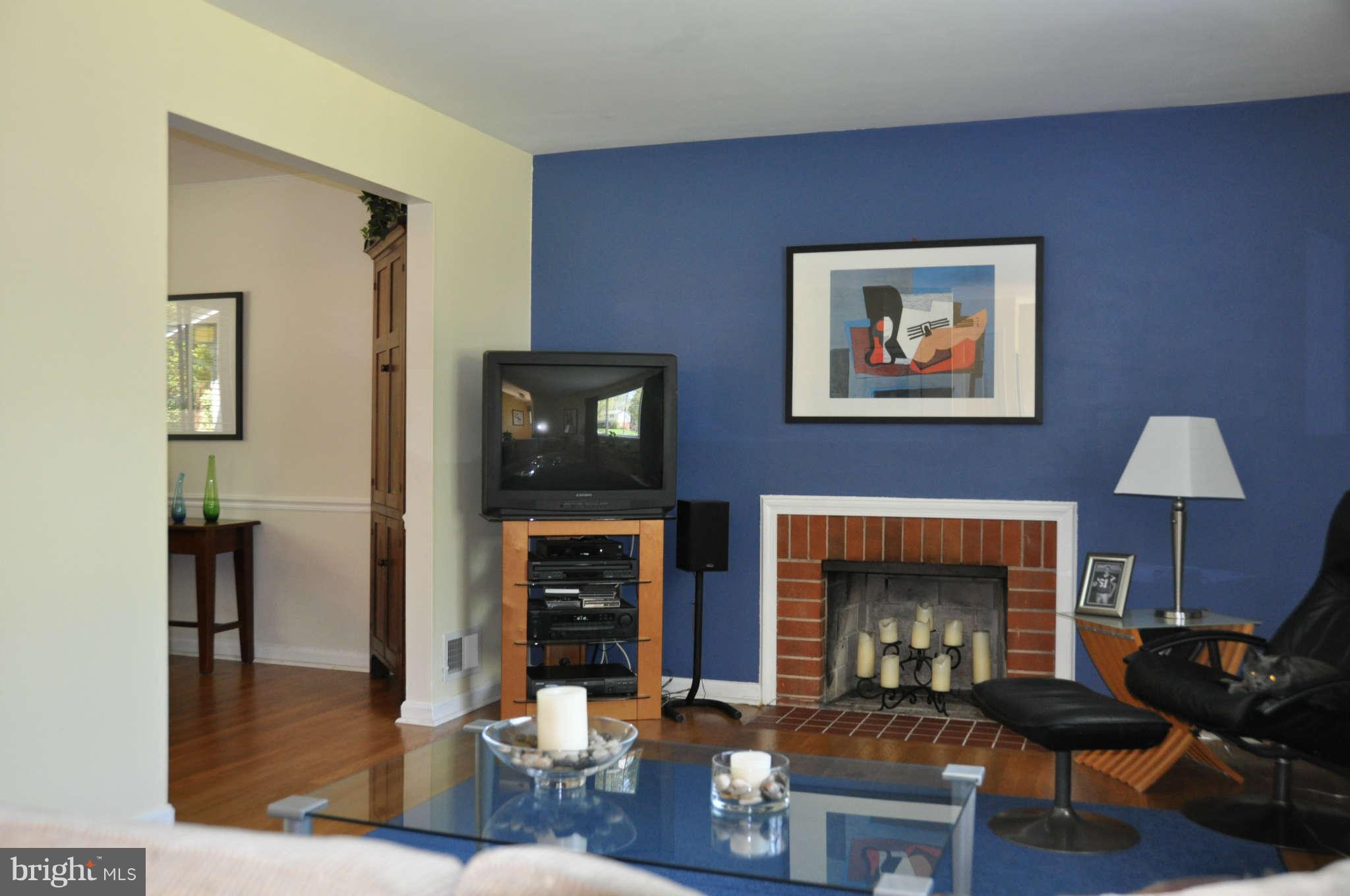 5507 Yorkshire Street Springfield, VA 22151 - Photo 2 of 26 a living room with furniture and a fireplace