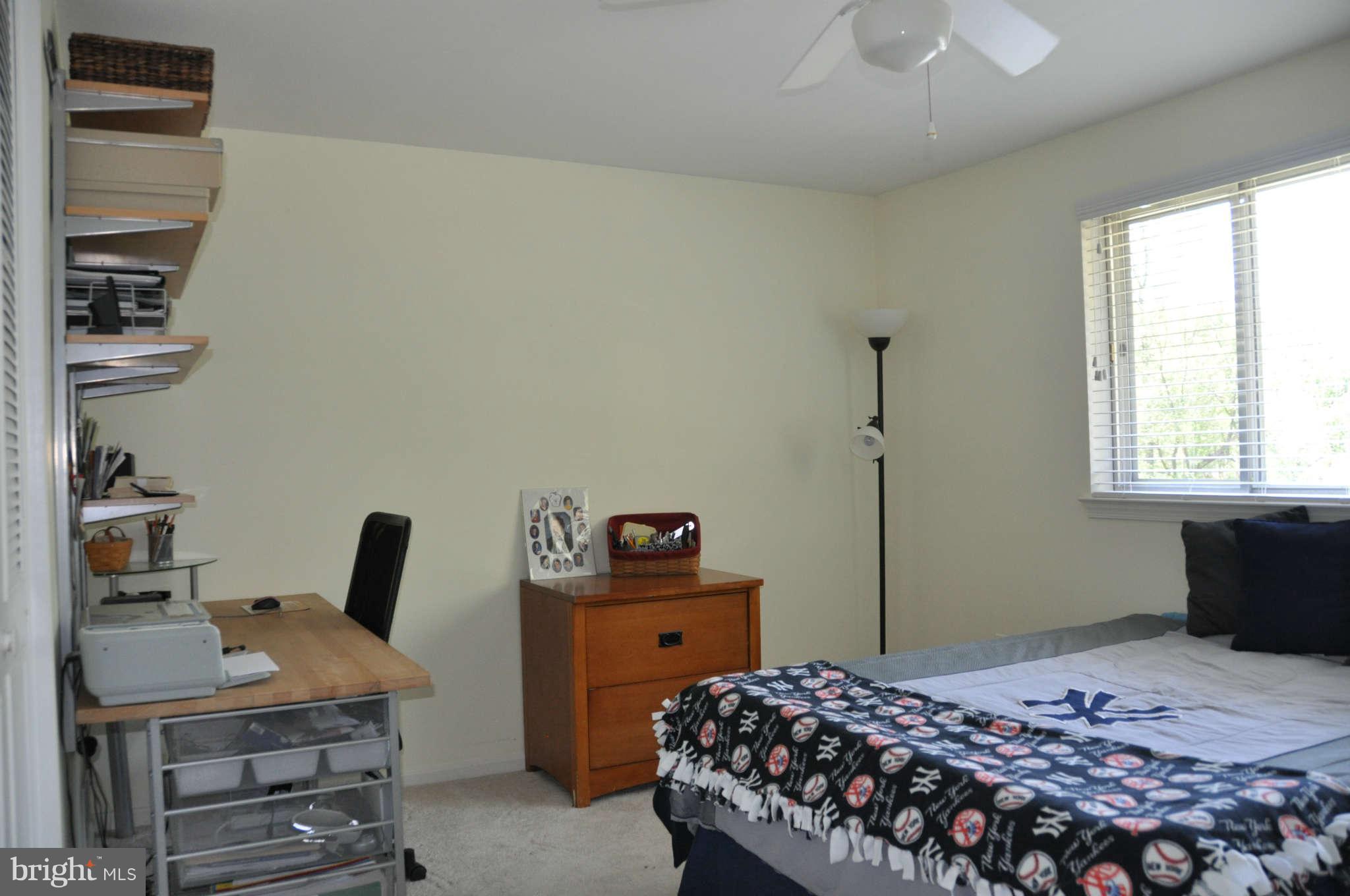 5507 Yorkshire Street Springfield, VA 22151 - Photo 18 of 26 a bedroom with a bed and a window