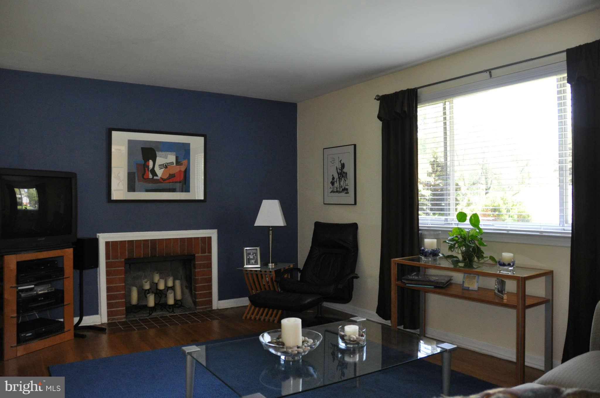 5507 Yorkshire Street Springfield, VA 22151 - Photo 3 of 26 a living room with furniture a fireplace and a large window