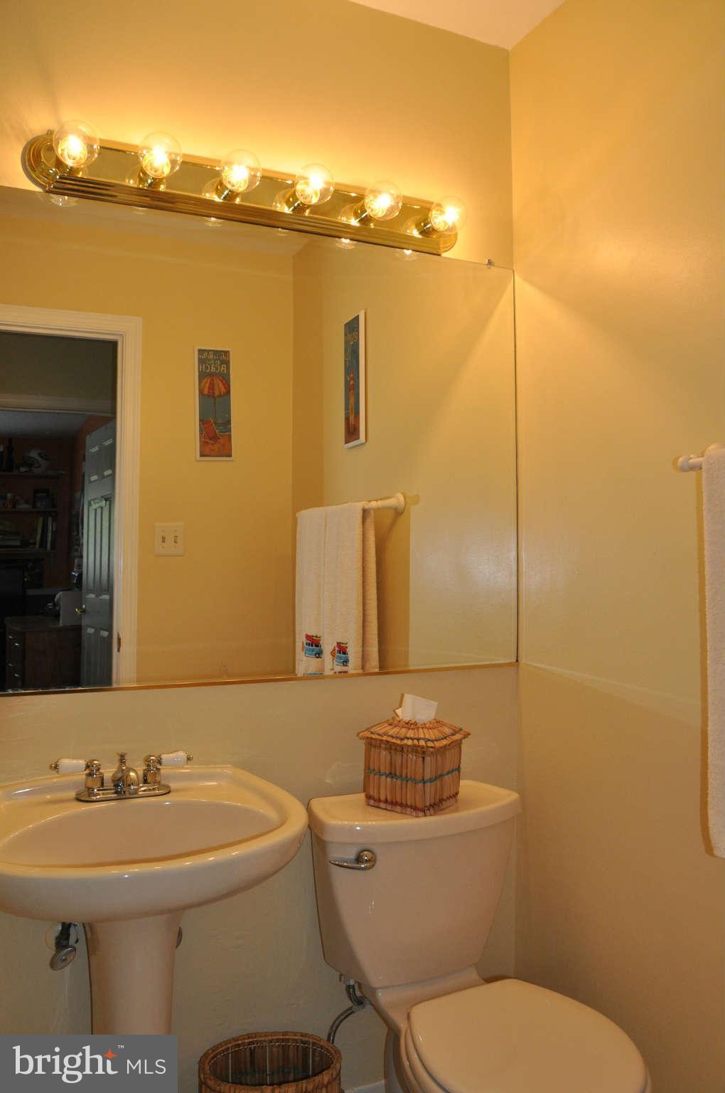 5507 Yorkshire Street Springfield, VA 22151 - Photo 22 of 26 a bathroom with a toilet sink and mirror