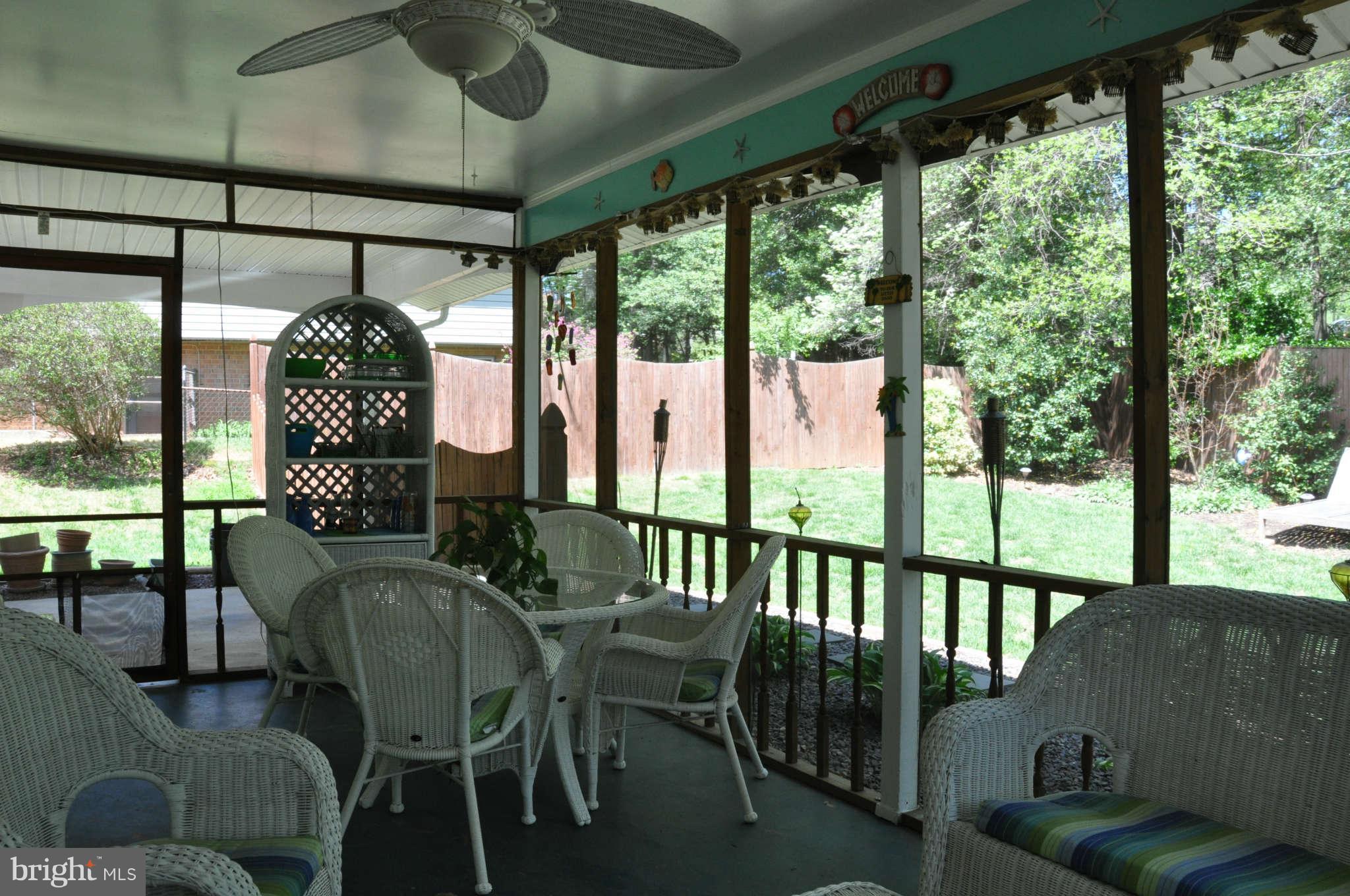 5507 Yorkshire Street Springfield, VA 22151 - Photo 24 of 26 a view of a porch with furniture and wooden floor