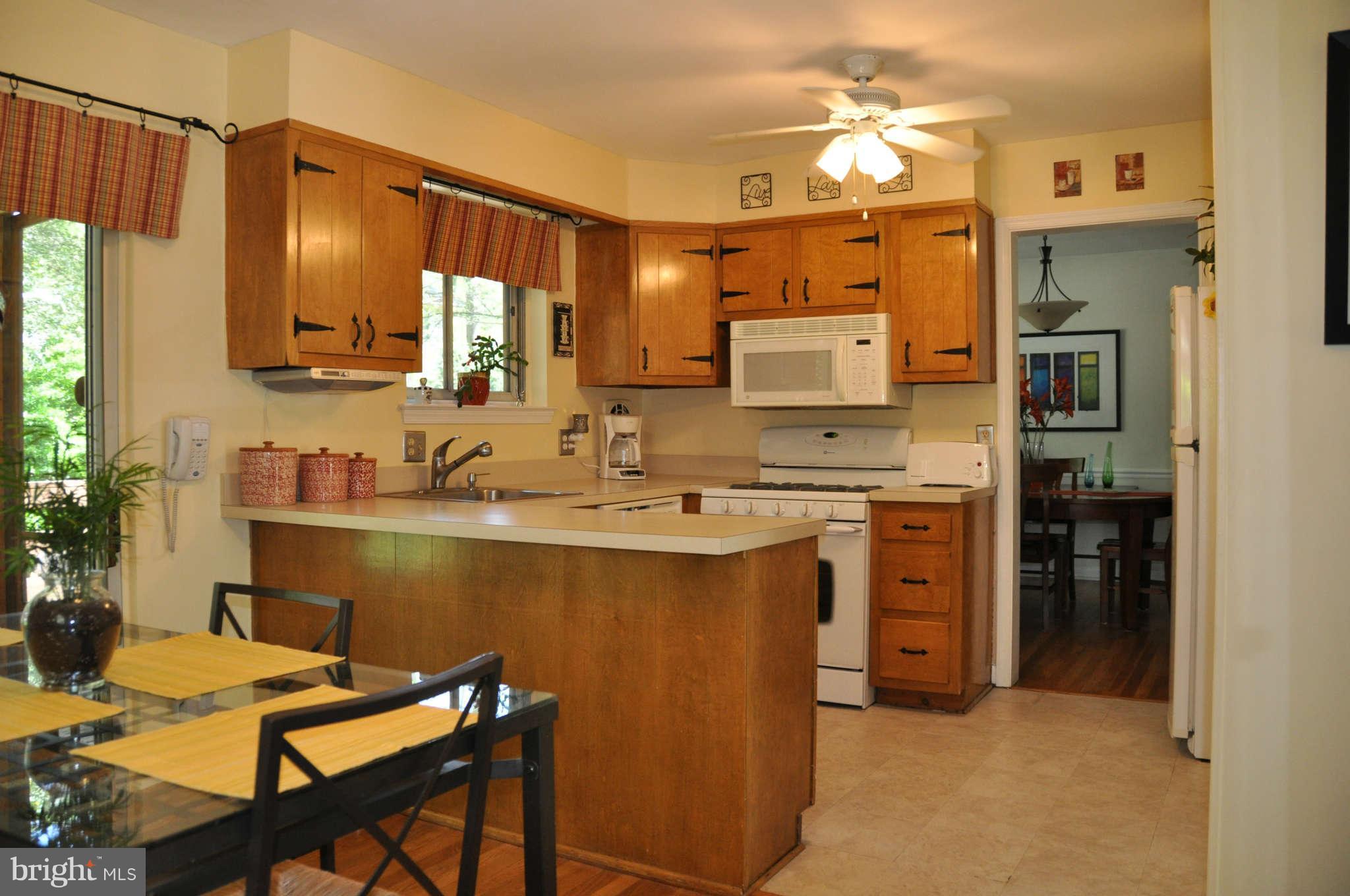 5507 Yorkshire Street Springfield, VA 22151 - Photo 8 of 26 a kitchen with cabinets a sink and appliances