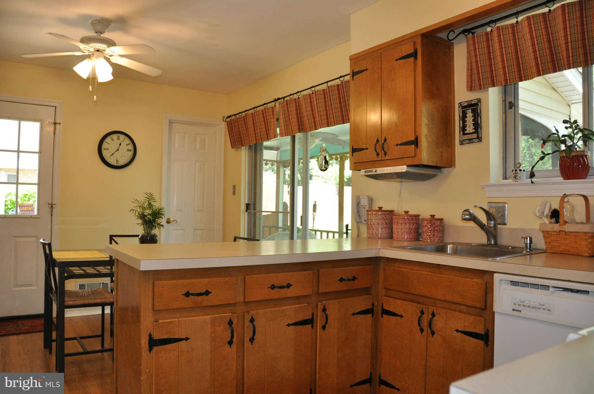 5507 Yorkshire Street Springfield, VA 22151 - Photo 9 of 26 a kitchen with a sink cabinets and window