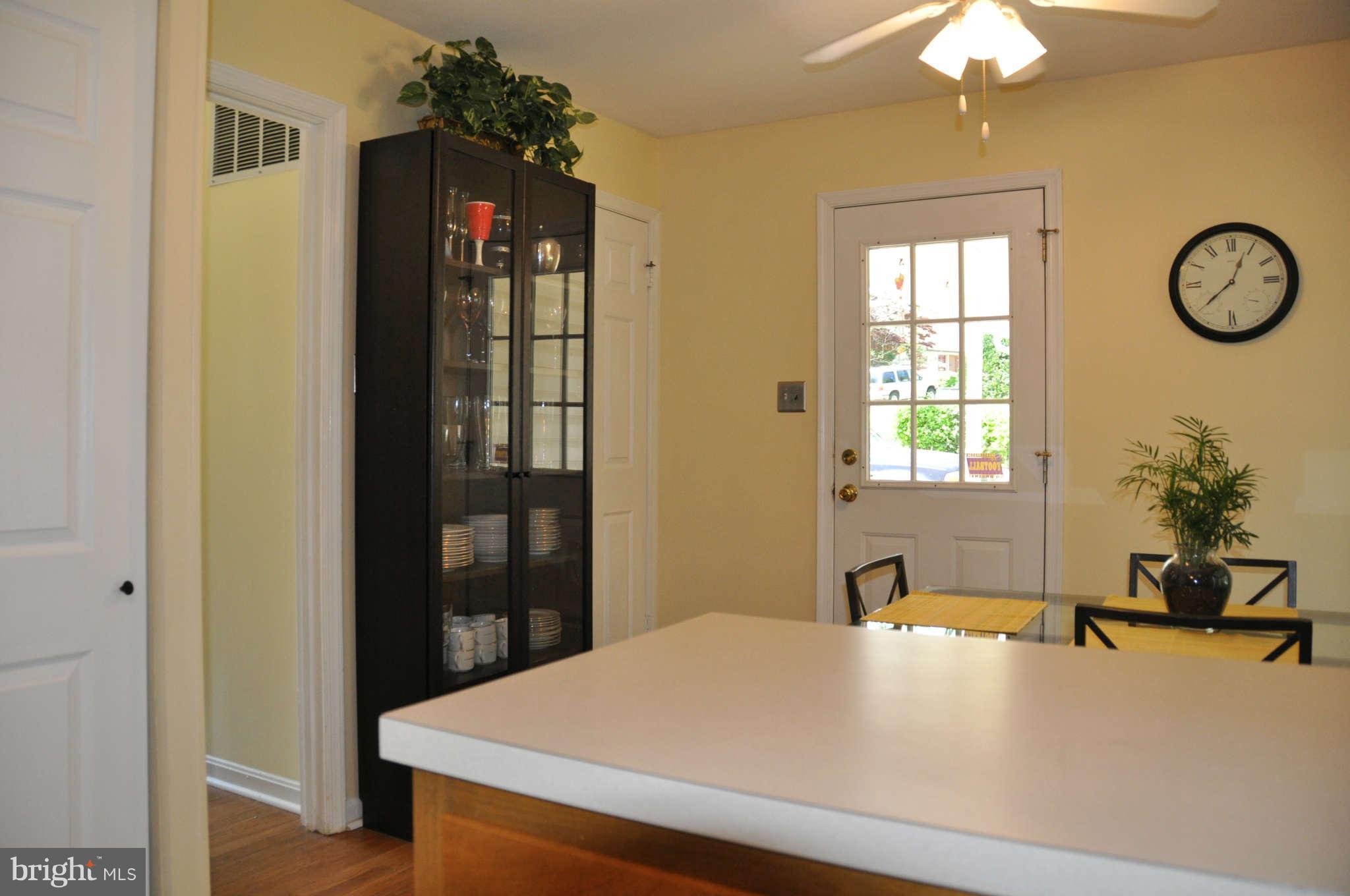 5507 Yorkshire Street Springfield, VA 22151 - Photo 10 of 26 a room with a table and a chandelier