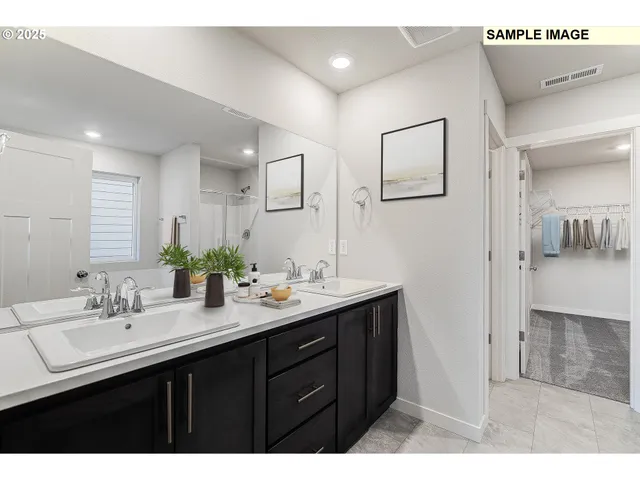 a bathroom with 2 sink and a mirror