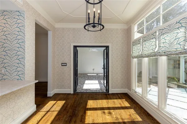 a view of a bathroom with a bathtub and wooden floor