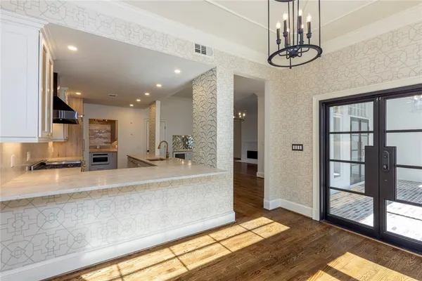 a view of a living room and kitchen