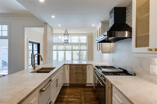 a kitchen that has a sink and a stove
