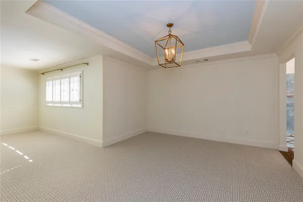 an empty room with a empty space and a window