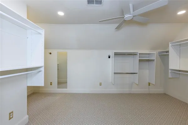 a view of storage and utility room with closet