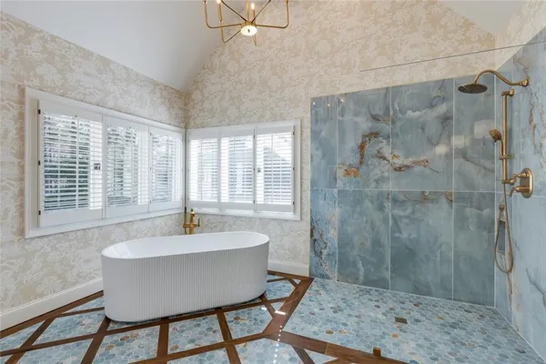 a dining room with a table and chairs