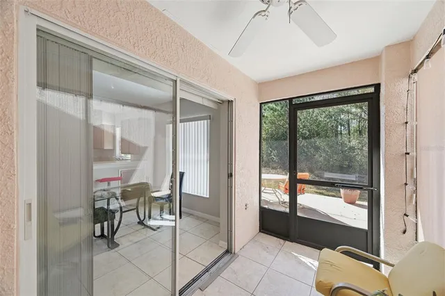 a view of a hallway with furniture and front door