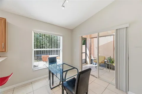 a dining room with furniture and window
