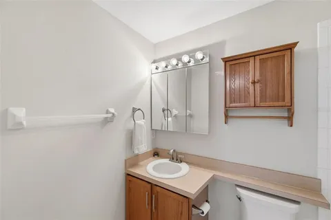 a bathroom with a sink and a mirror