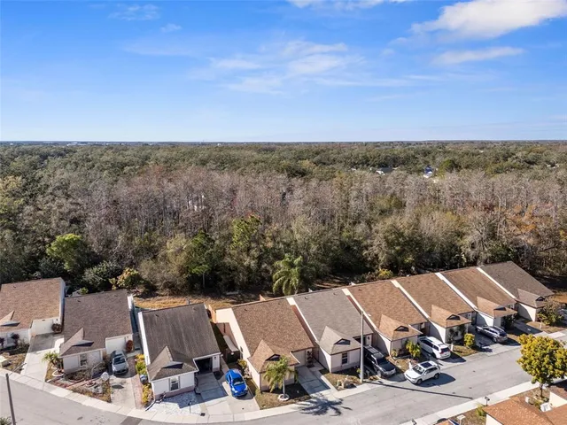 a view of multiple houses with a city