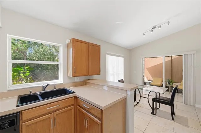 a kitchen with a stove a sink and a refrigerator