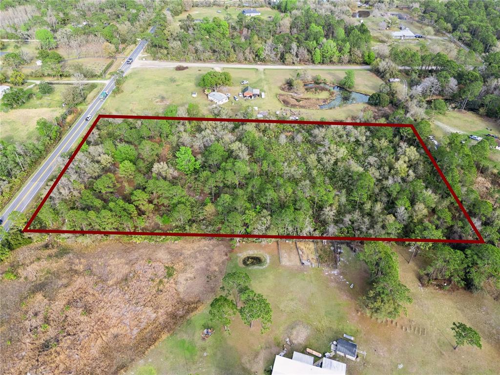 541 East Osceola Road Geneva, FL 32732 - Photo 5 of 31 a view of a garden from a balcony