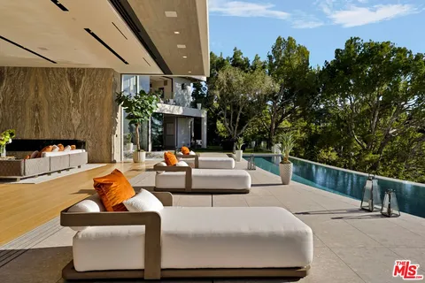 a view of a swimming pool with a patio