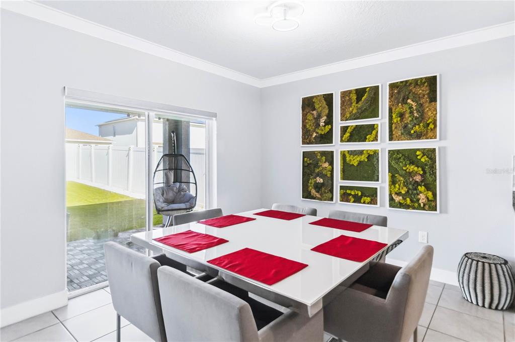 1759 Copinger Terrace Kissimmee, FL 34744 - Photo 12 of 29 a view of a dining room with furniture and window