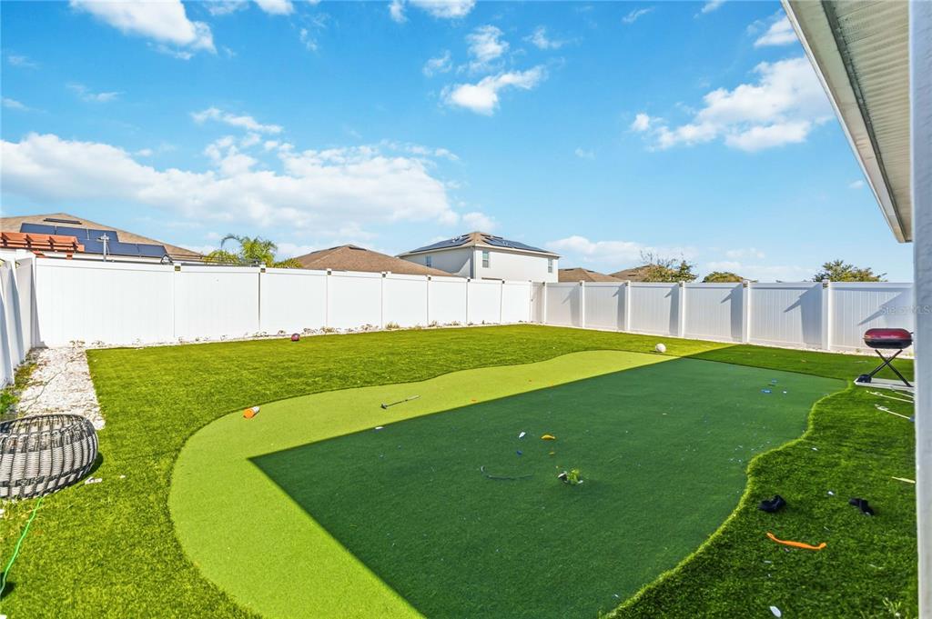 1759 Copinger Terrace Kissimmee, FL 34744 - Photo 25 of 29 a view of a garden with a building in the background