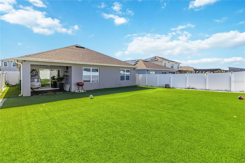 1759 Copinger Terrace Kissimmee, FL 34744 - Photo 26 of 29 a view of a house with a big yard and large tree