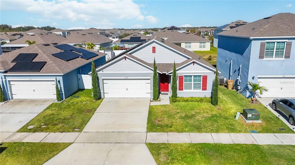 1759 Copinger Terrace Kissimmee, FL 34744 - Photo 27 of 29 a front view of a house with a yard