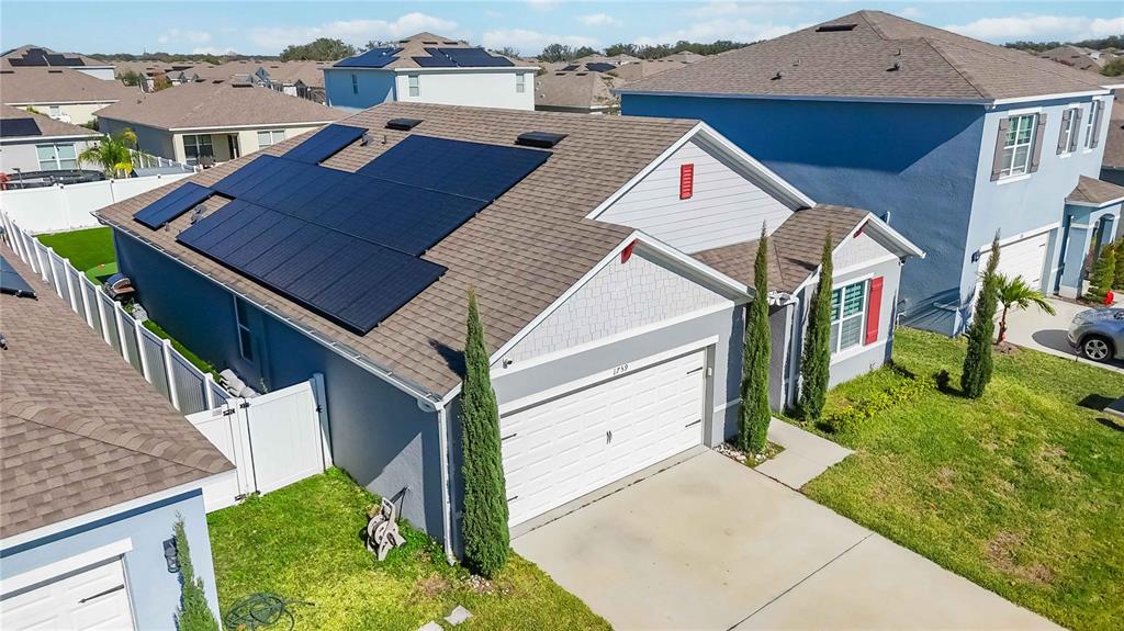 1759 Copinger Terrace Kissimmee, FL 34744 - Photo 28 of 29 a aerial view of a house with a yard