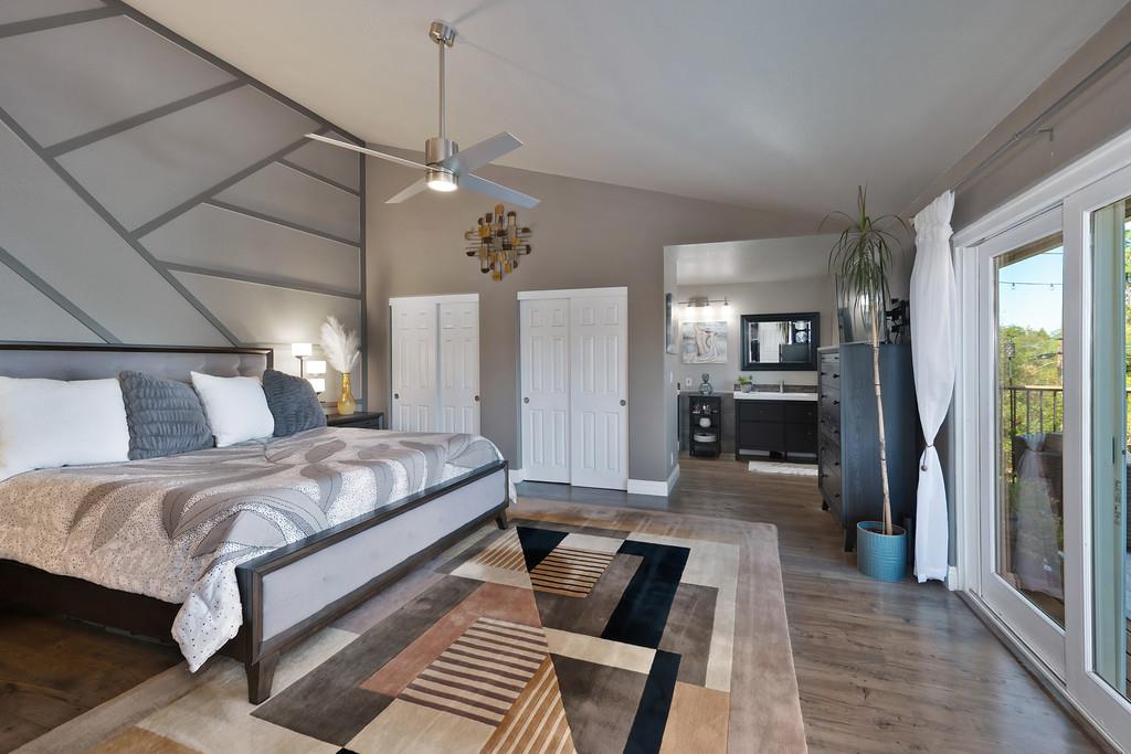 2378 Cascade Trail Cool, CA 95614 - Photo 19 of 57 a bedroom with a bed and wooden floor