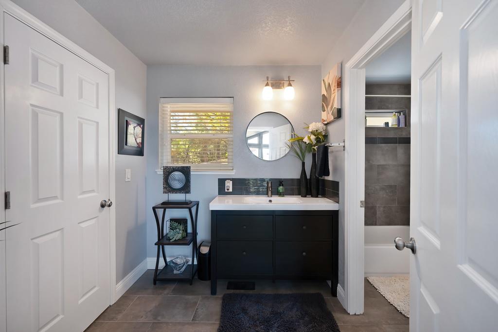 2378 Cascade Trail Cool, CA 95614 - Photo 26 of 57 a view of a bathroom with sink mirror and window