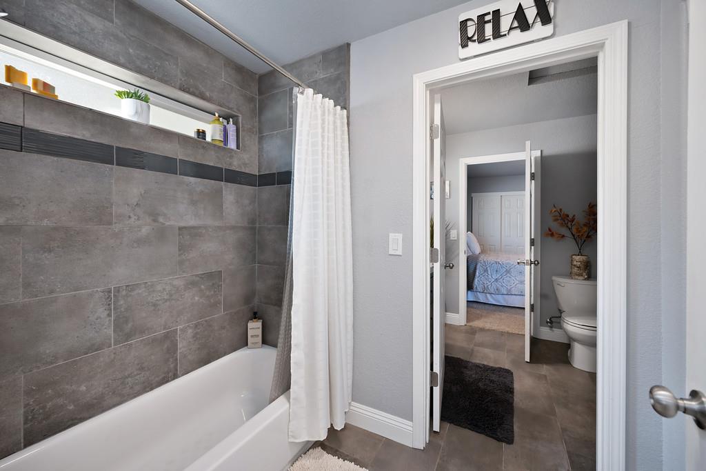2378 Cascade Trail Cool, CA 95614 - Photo 29 of 57 a bathroom with a bathtub and a shower