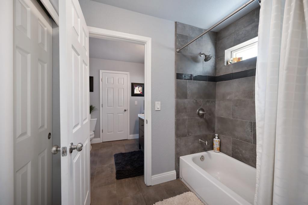 2378 Cascade Trail Cool, CA 95614 - Photo 30 of 57 a bathroom with a bathtub and a shower