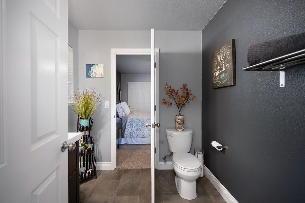 2378 Cascade Trail Cool, CA 95614 - Photo 31 of 57 a white toilet sitting next to a bathroom sink