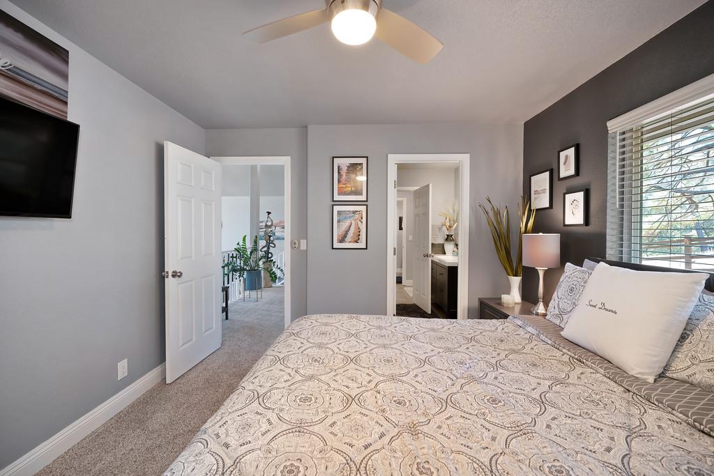 2378 Cascade Trail Cool, CA 95614 - Photo 34 of 57 a bedroom with a bed and a flat screen tv