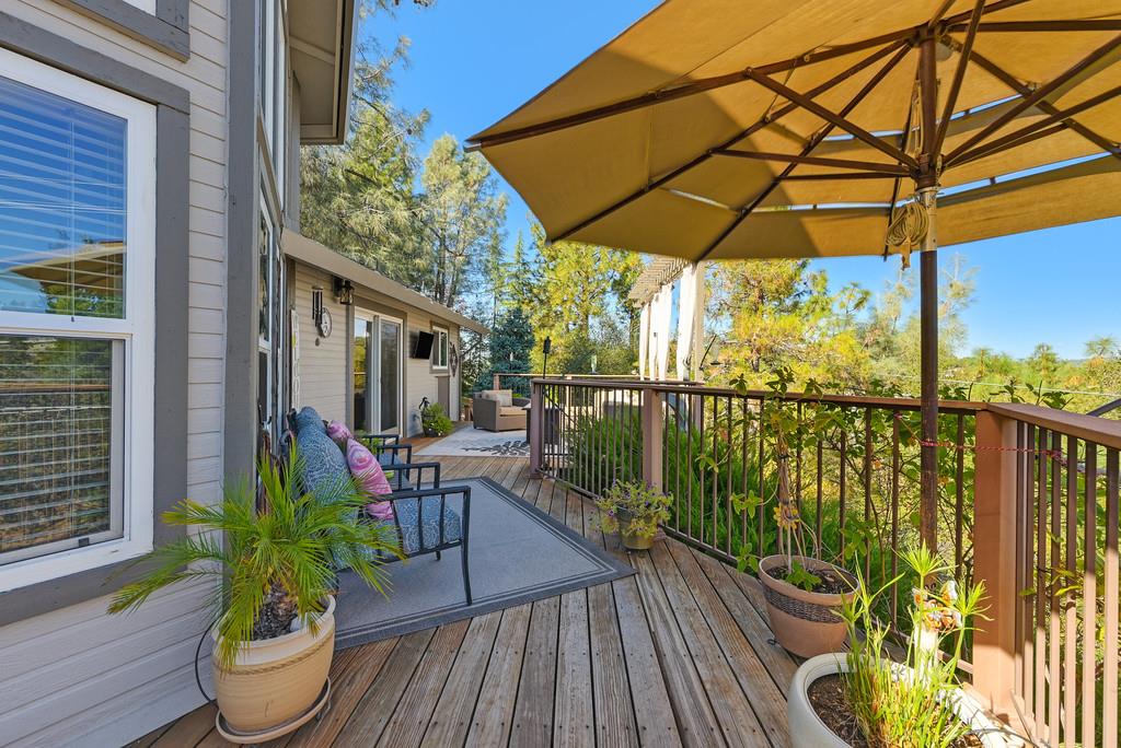 2378 Cascade Trail Cool, CA 95614 - Photo 37 of 57 a view of a balcony with chairs and wooden floor
