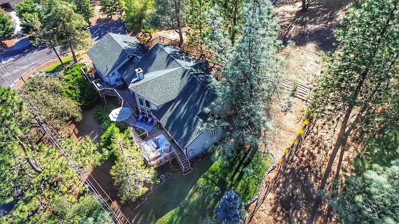 2378 Cascade Trail Cool, CA 95614 - Photo 54 of 57 an aerial view of a house with a yard and garden