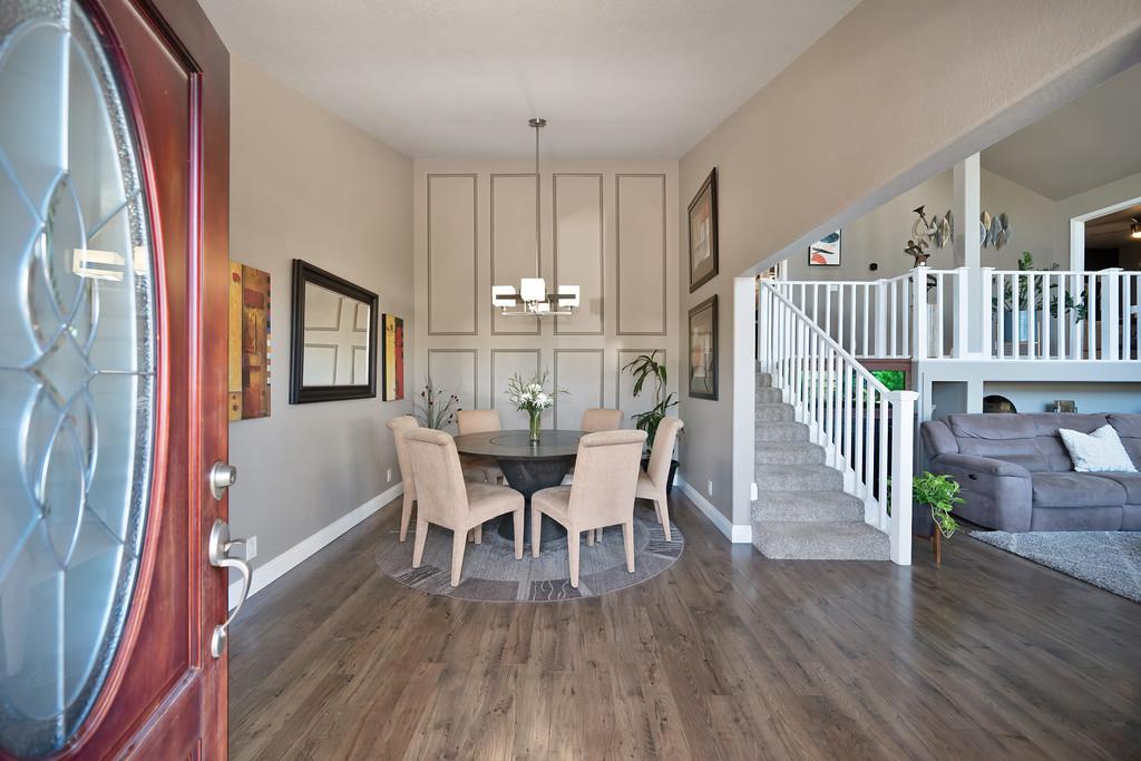 2378 Cascade Trail Cool, CA 95614 - Photo 6 of 57 a view of a dining room with furniture and wooden floor