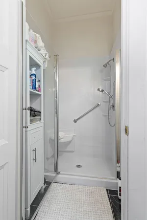 a kitchen with stainless steel appliances granite countertop a refrigerator a sink dishwasher and wooden cabinets