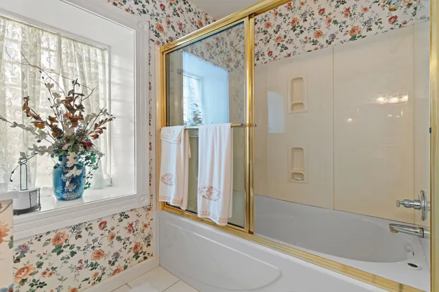 a kitchen that has a lot of cabinets a sink and appliances in it