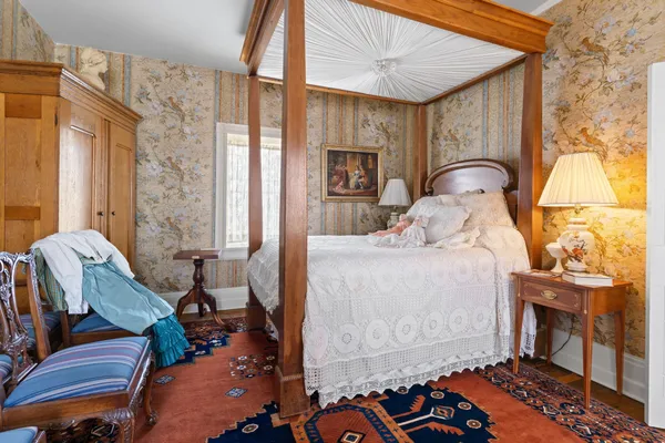 a large room with a bed and furniture