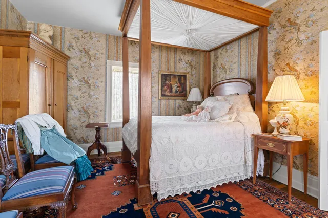 a large room with a bed and furniture